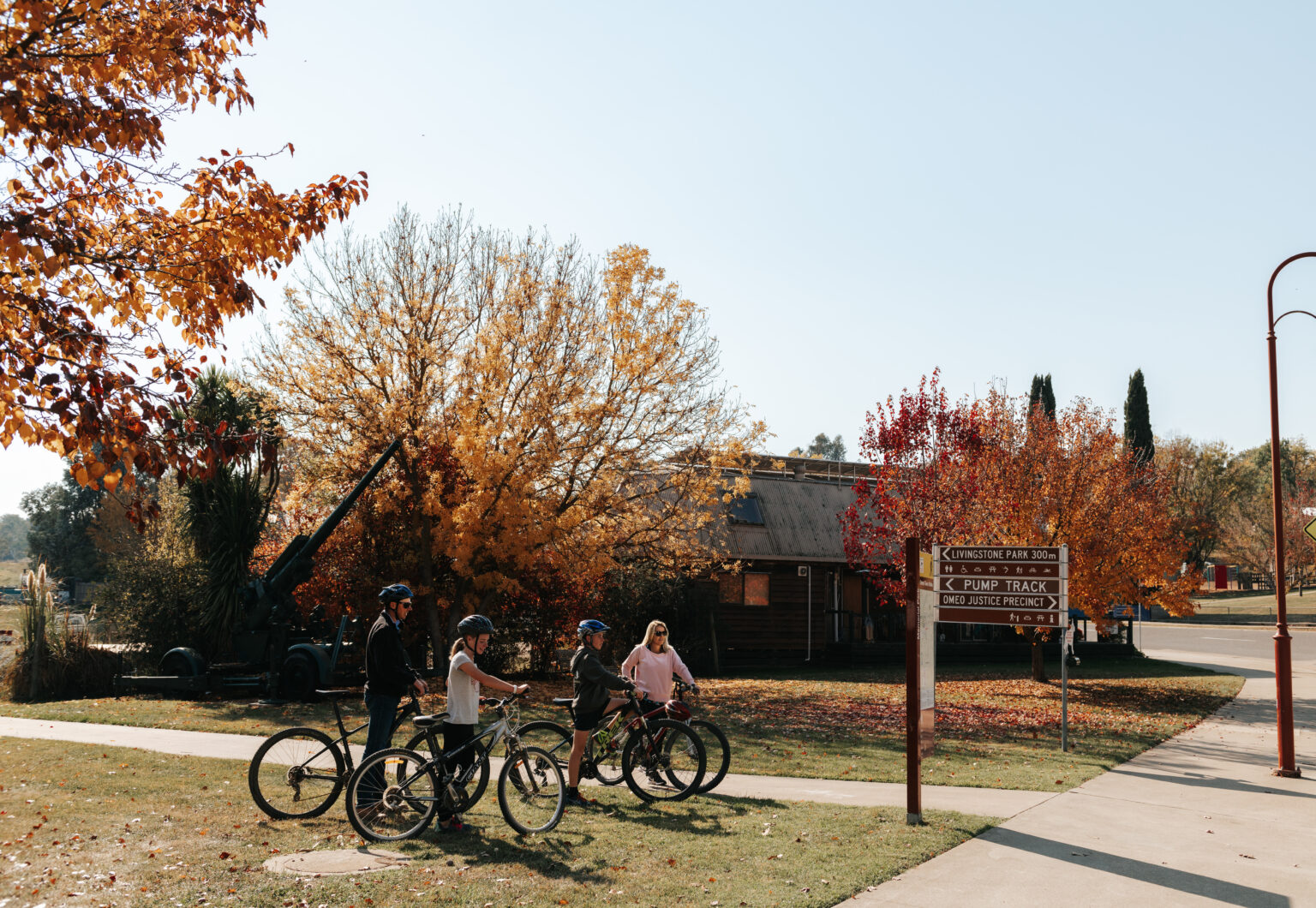 Family cycling at Omeo livingstone park on an Autumn's day