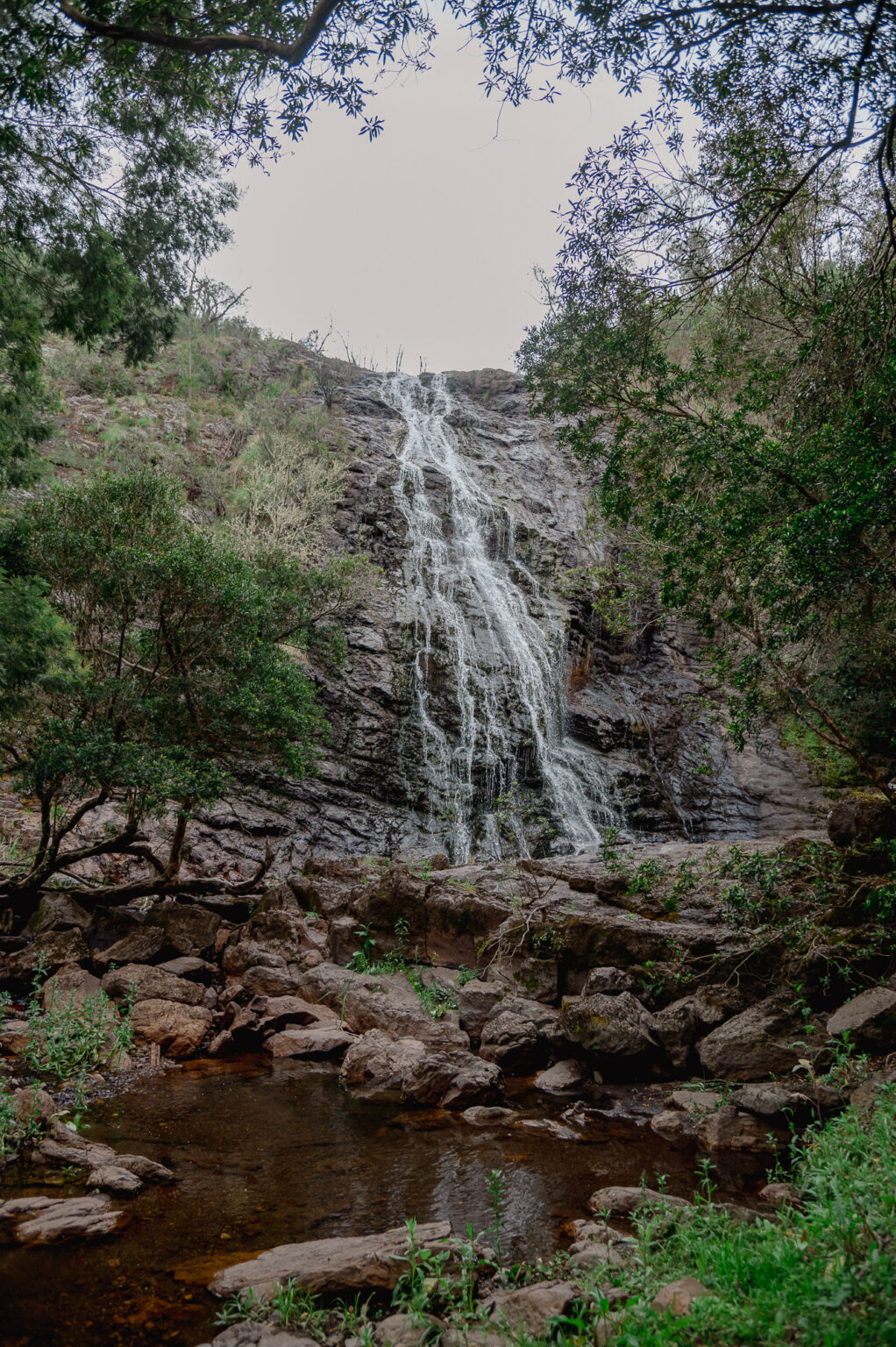 A beautiful waterfall cascading down a rocky cliff face.
