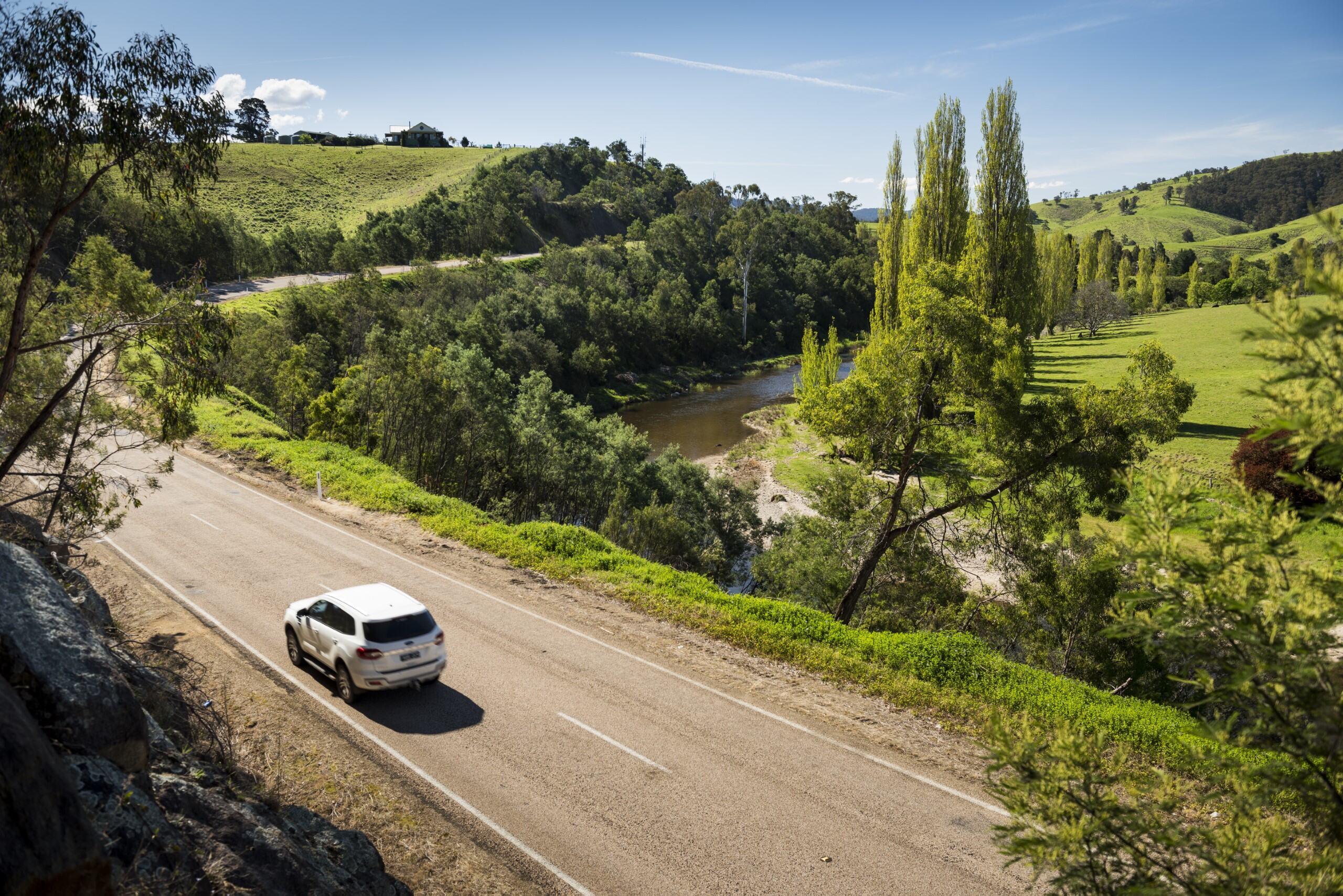 Vehicle driving beside the Tambo River